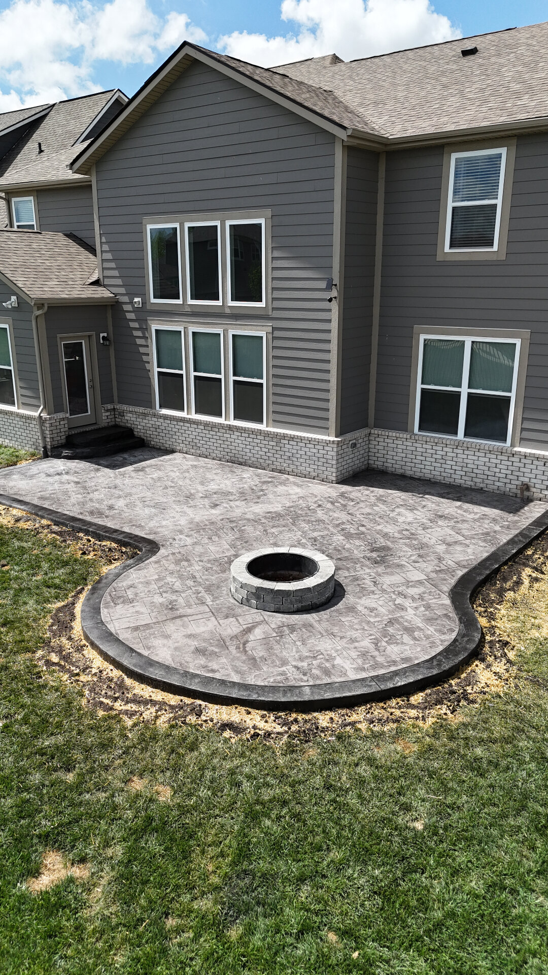 Stamped concrete patio with fire pit