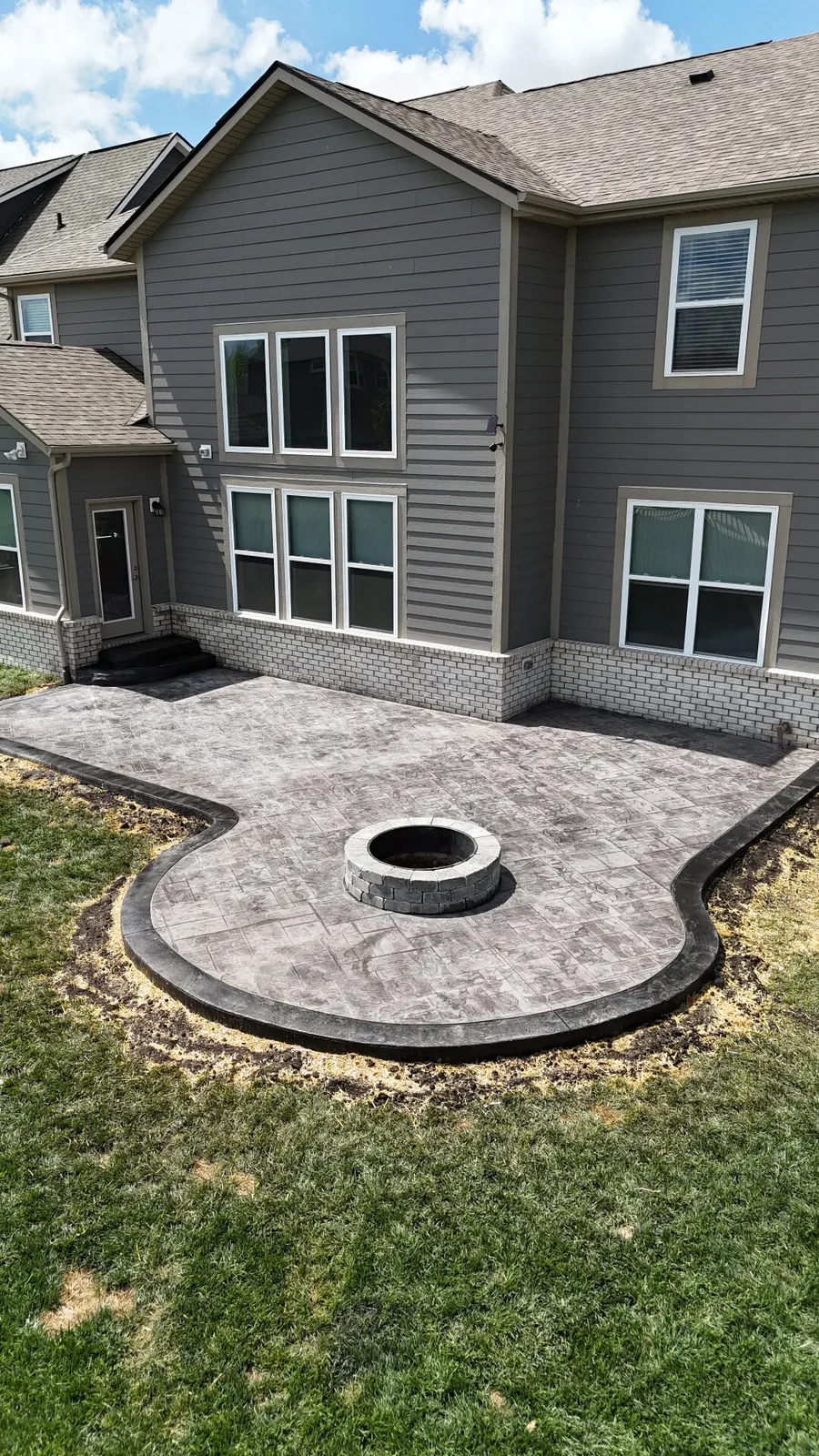 Stamped concrete patio with fire pit